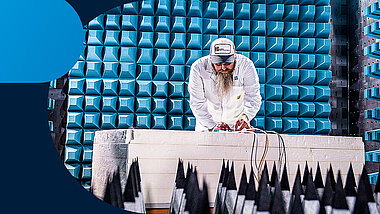 A man tests something in the EMC test room in the TQ-PCC