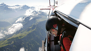 Skydiver green mountains