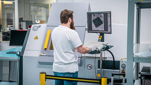 A man at an X-ray test machine