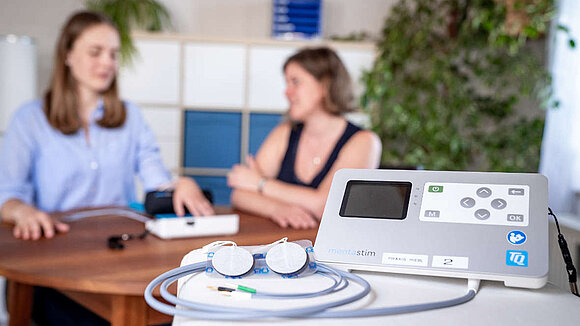 Therapist behind medical device