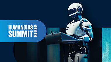 Humanoids Summit 2025 Humanoider an einem Pult