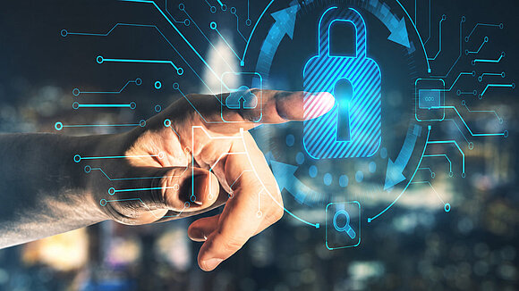 Hand touching a digital lock symbolizing cybersecurity