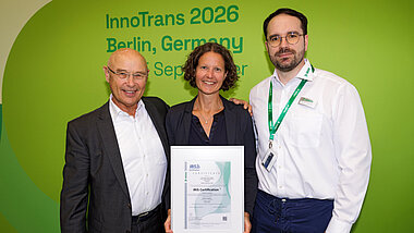 Detlef Schneider, Sybille Stieglbauer, and Sascha Langermann with their IRIS certification certificates