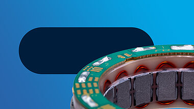 Close-up of a torque motor against a blue background