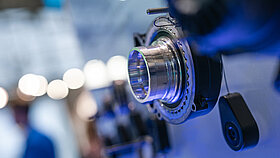 Close-up view of a motor cross-section on a trade show wall