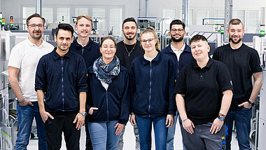 Gruppe von Mitarbeitern in Produktion