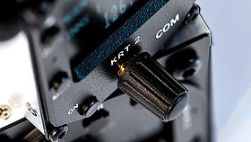 Detailed view of a rotary dial on a radio