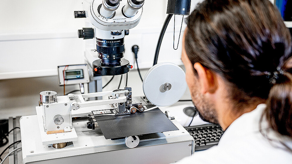 An employee is testing something during a wear test