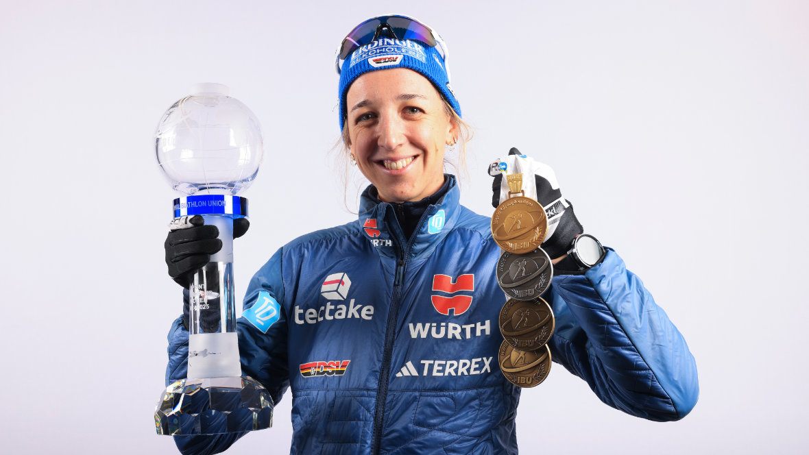 Biathlete Franziska Preuß with the overall World Cup globe and medals