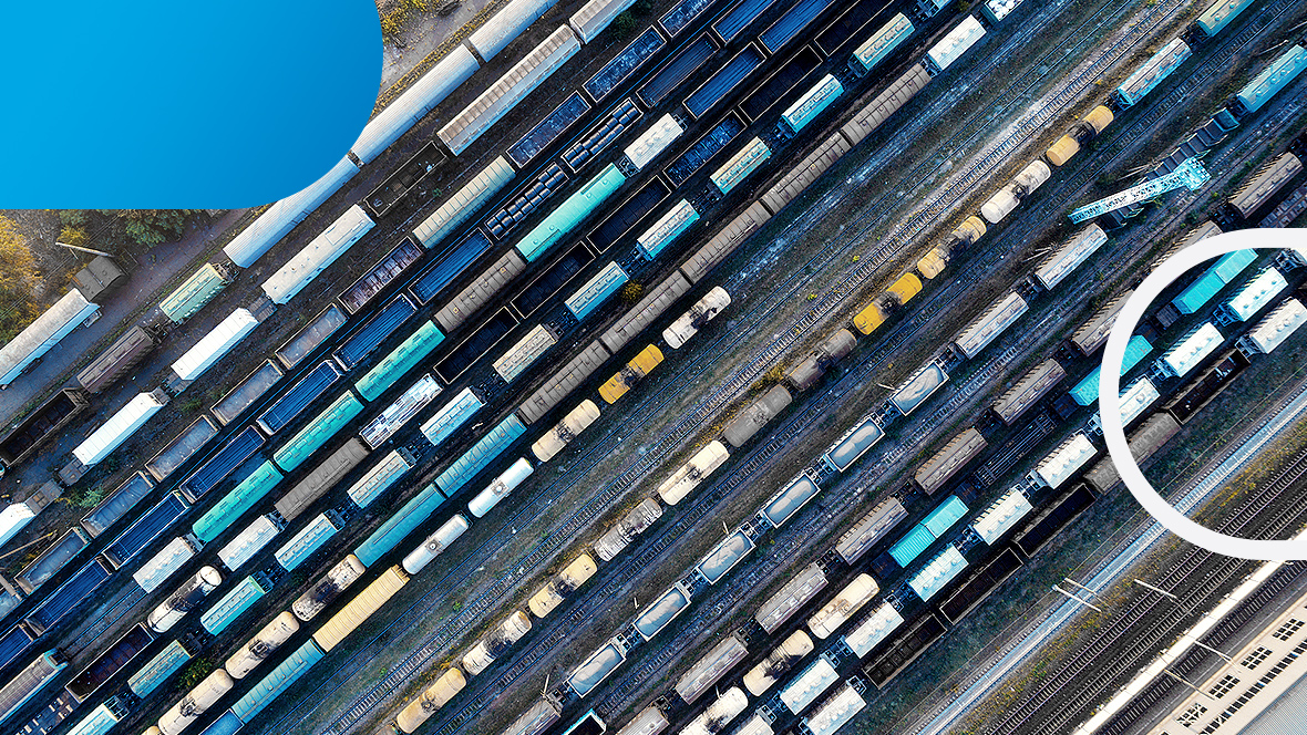 A bird's eye view of rails with many wagons