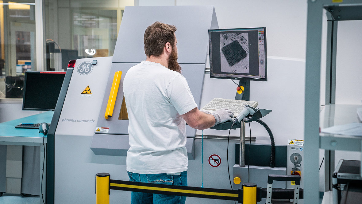 A man at an X-ray test machine