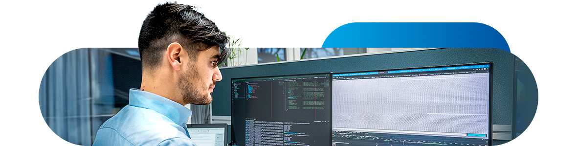 A man sits in front of a PC screen