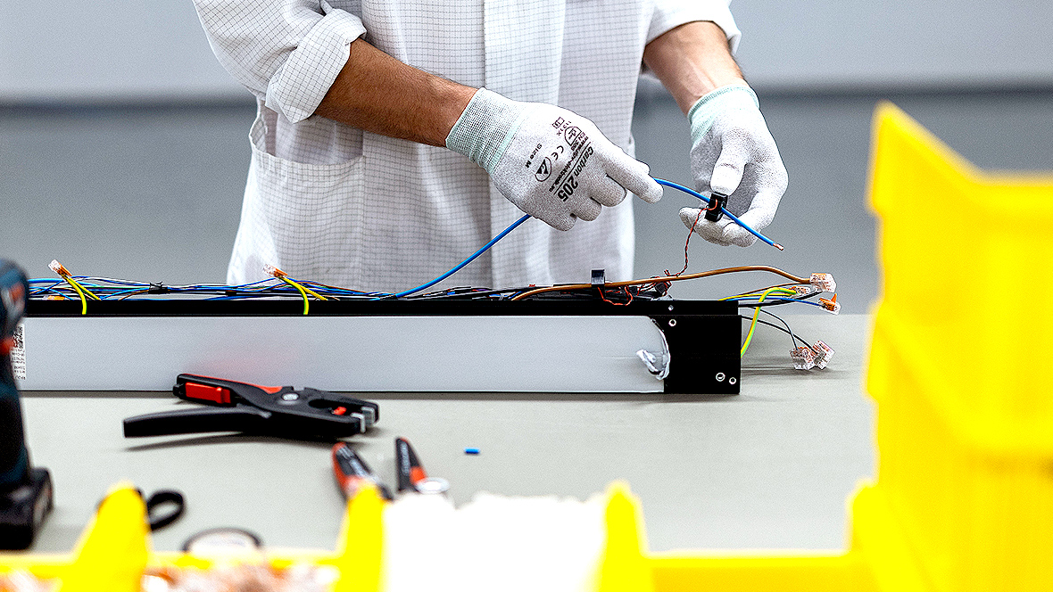 Detail of a person assembling components